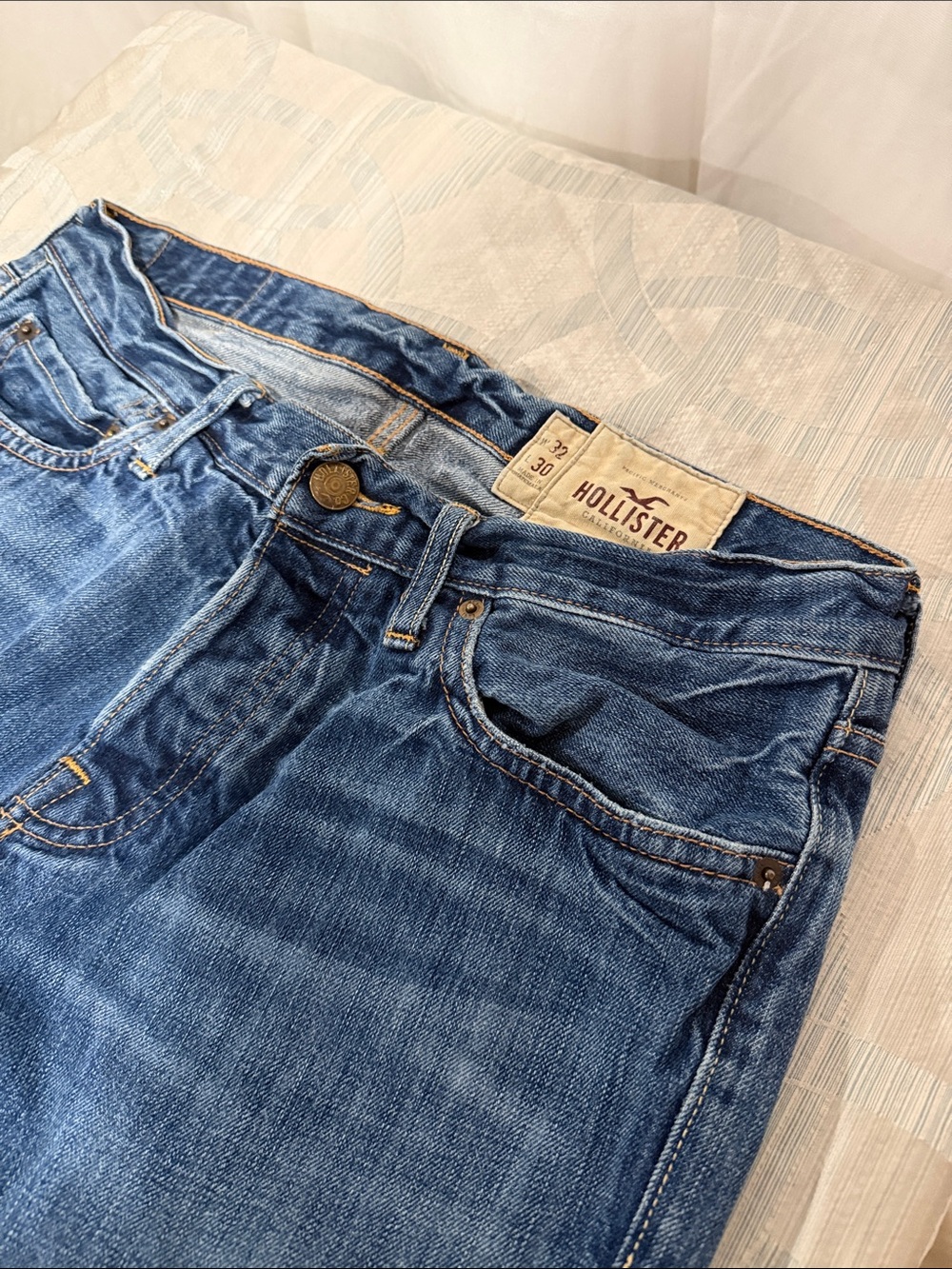 Hollister jeans with frayed/ torn bottom hem